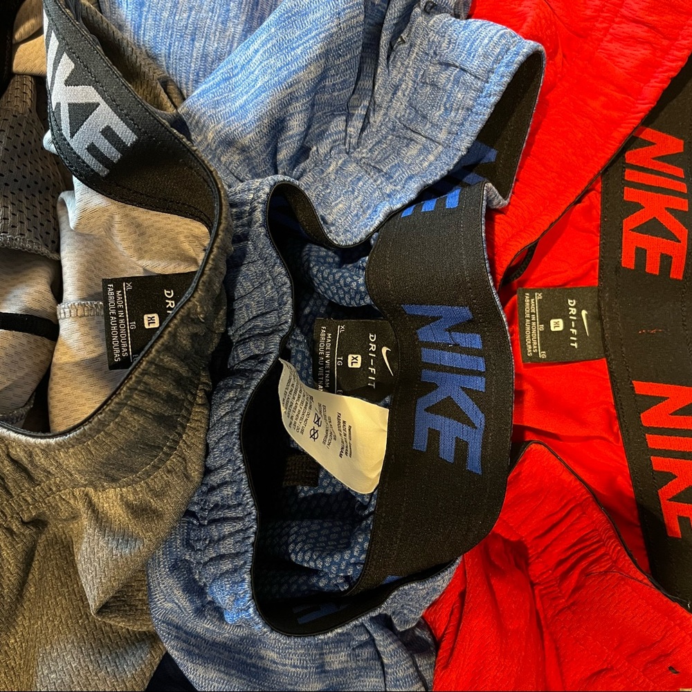 Nike Dri Fit shorts. 3 pairs-gray, blue, and red.  All size XL.